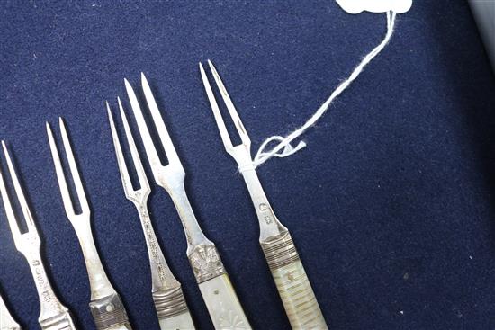 Seven 19th century and later silver and mother of pearl handled travelling forks a similar silver fruit knife and three other items.